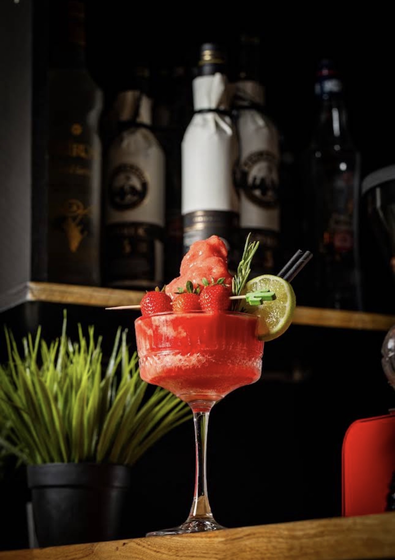 A strawberry signature cocktail at the bar