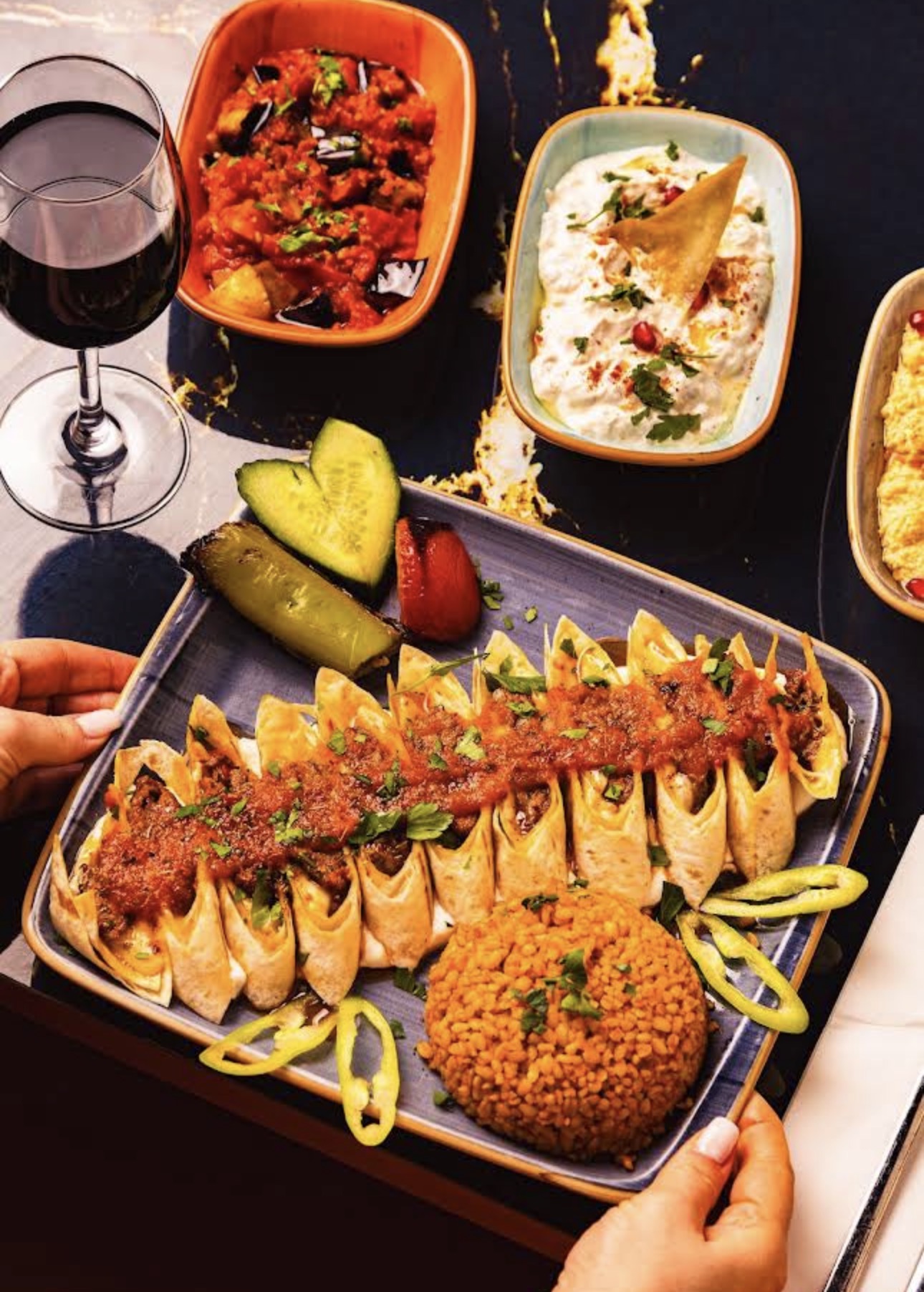 A Turkish wrap platter with bulgur and meze